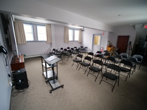 The Wellington Branch Library meeting room with chairs arranged for a presentation.