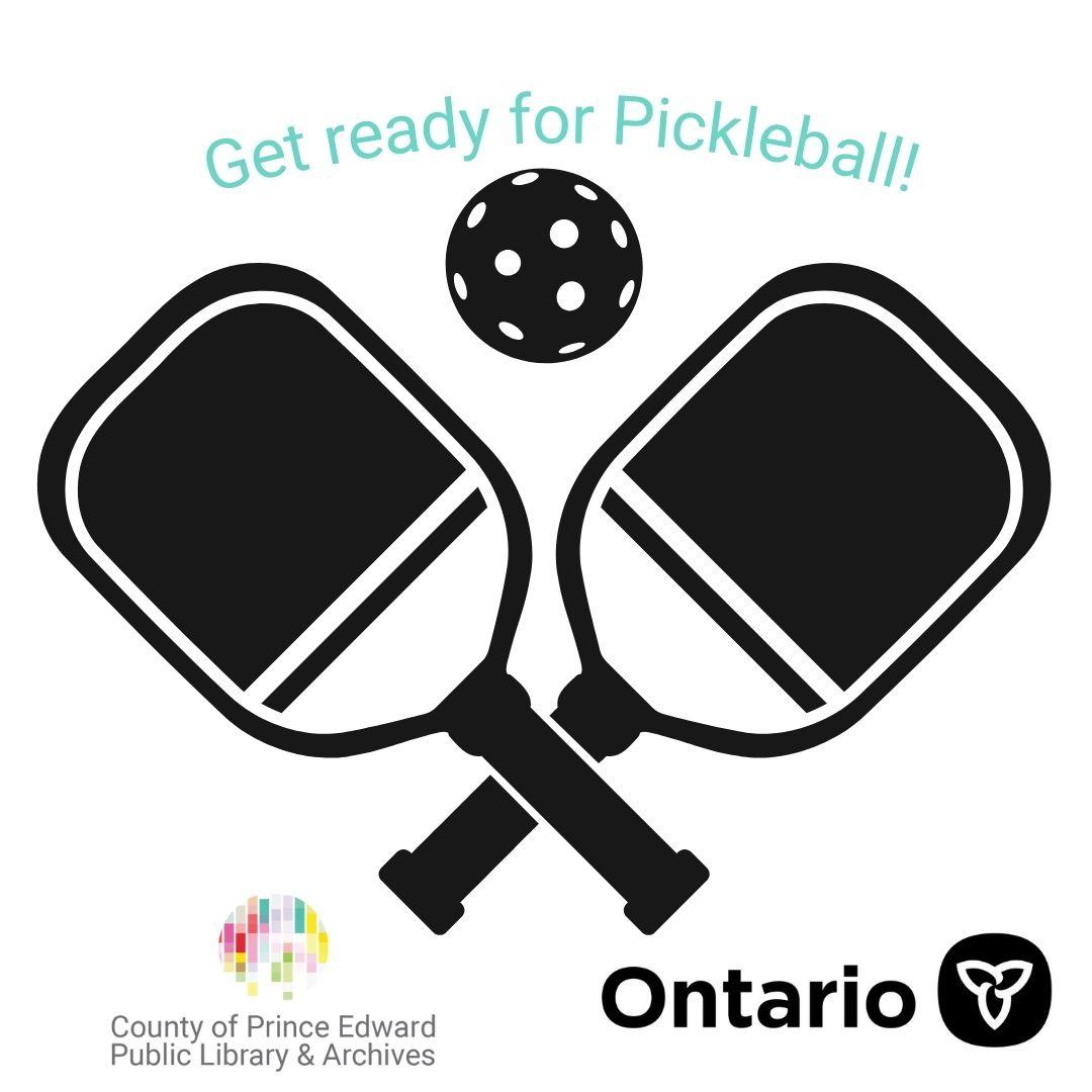 Two pickleball paddles crossing