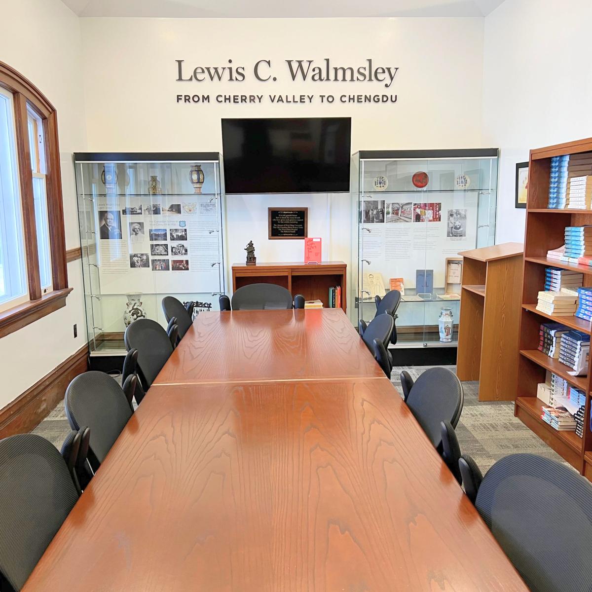 Conference table, chairs and television screen